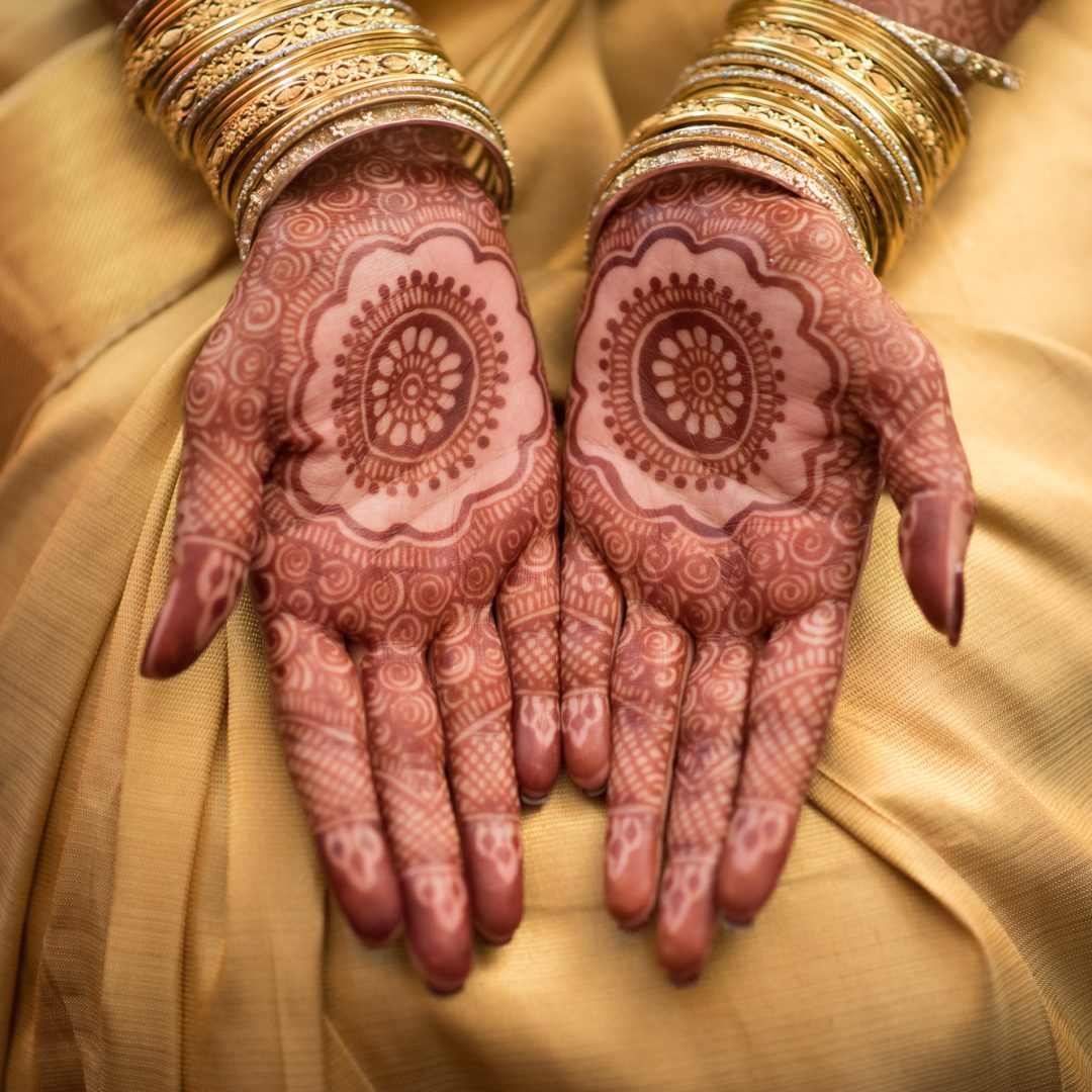 Female hands showing henna tattoos