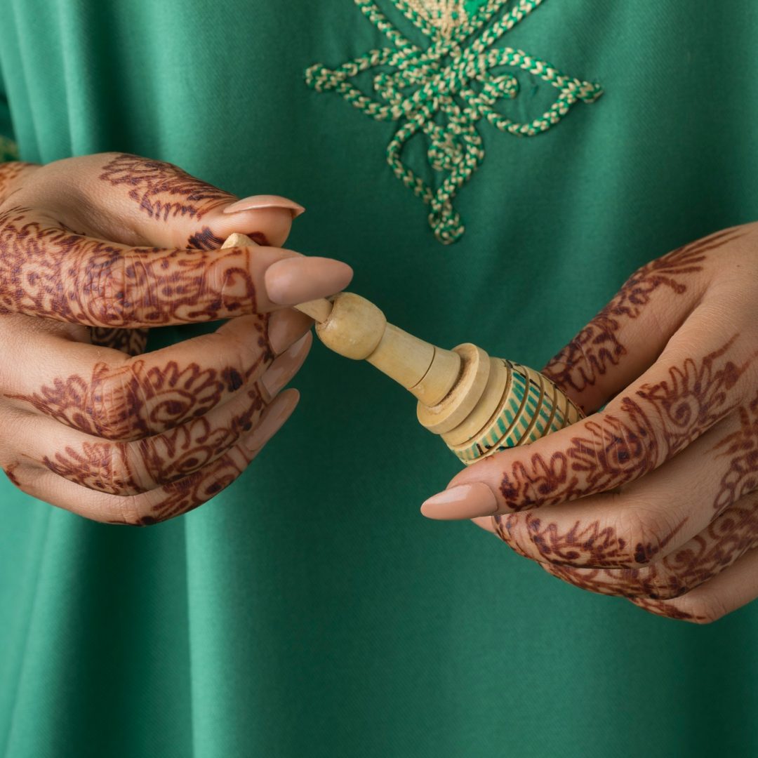 Moroccan woman with henna painted hands